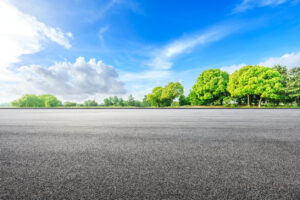 Empty asphalt road ground and green woods in the countryside nature park