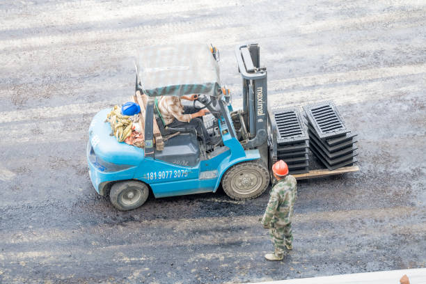 Freshly paved asphalt driveway by Integrity Paving and Coatings team