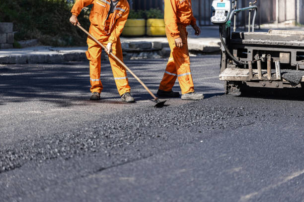 Paving crew working driveway project in Parker Heights area.