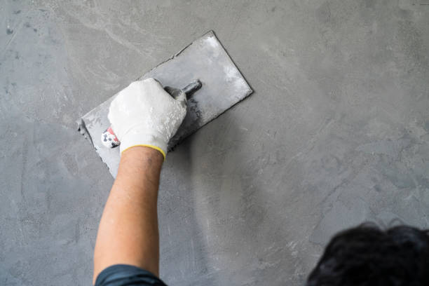 Integrity Paving and Coatings leveling damaged residential concrete slabs carefully