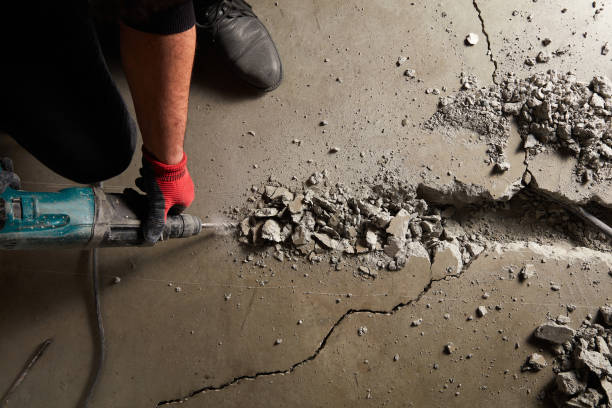 Concrete repair crew restoring cracked driveway in San Antonio TX residential area