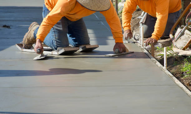 Integrity Paving and Coatings leveling damaged residential concrete slabs carefully
