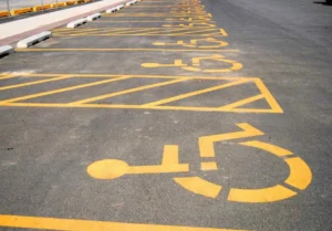 Fresh fire lane and curb markings defining restricted parking areas in New Braunfels, TX. Parking lot striping near me