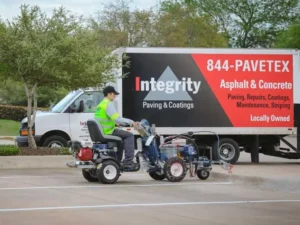 Fresh parking lot striping with clearly marked spaces at a commercial property in Smithville, TX. parking lot striping near me