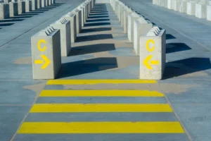 Pavement stencil positioned for detailed parking lot marking in Dripping Springs, TX. Parking lot striping near me