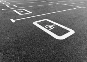 Painted markings separating specialized vehicle parking spaces in Elgin, TX. Parking lot striping near me